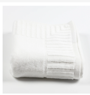 Close-up detail of white piano key border towel