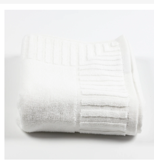 Close-up detail of white piano key border towel