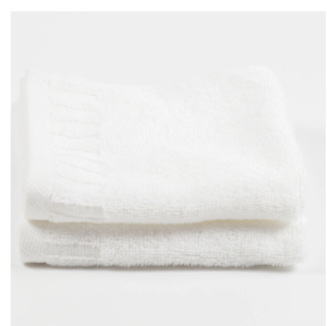 Folded white piano key border hospitality towel