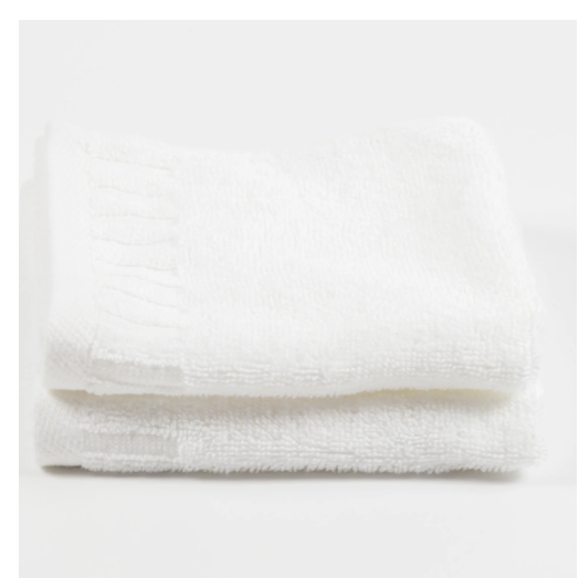 Folded white piano key border hospitality towel